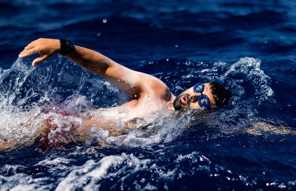 Neil Agius swimming in open water
